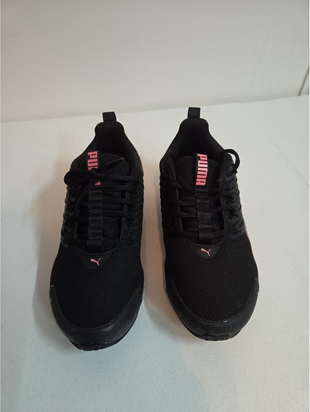 women's black and pink Puma size 8.5